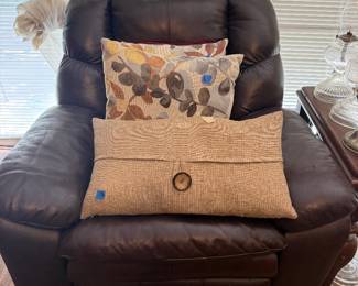 Rocking leather recliner and pillows
