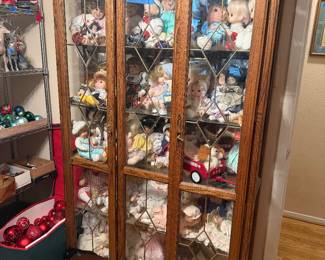 Vintage Dolls and oak display cabinets