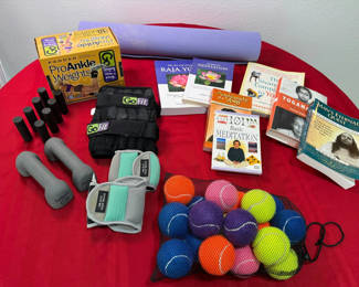 Lot 59: Fitness equipment, yoga mat, massage tools, and meditation books
