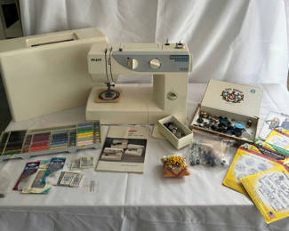 Lot 155: Pfaff Hobby 1030 sewing machine with accessories and patterns