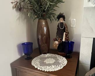 Vintage Porcelain Doll with Leopard Print Coat and Lace Doily