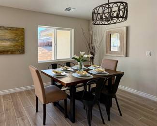 Square dining table and chairs, table settings, dishes, florals, wall mirror, napkins and placemats