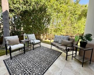 Multiple patio sets with chairs, rugs, tables, sofas, side tables,  outdoor pillows  and plants