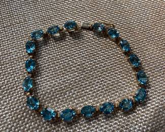 #14 - $650 - Blue topaz (18) on yellow gold 10kt bracelet 7"long, 8.5gr.
