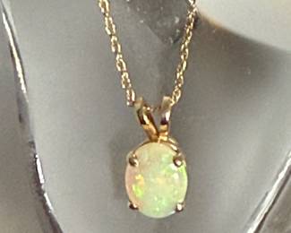 #17 - $295 - 18" chain 10kt gold with opal oval pendant. 1.4gr 