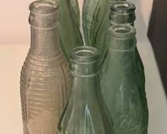 Coca-Cola bottles, some from Gloucester and Urbanna, Virginia. Orange Crush bottle marked 'Gloucester'
