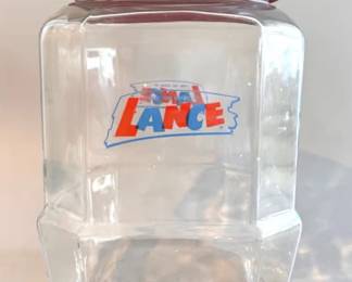 Vintage Lance octagonal glass counter display jar with a red metal lid