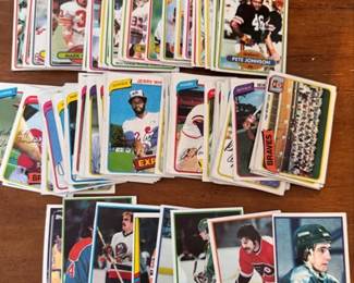 Collection of baseball, football, hockey and basketball trading cards