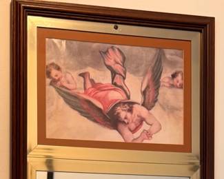 Detail at top of vintage cherub motif mirror