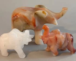 Two onyx elephants and a quartz elephant
