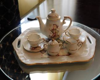 Reutter Porzellan miniature tea set featuring delicate M.J. Hummel illustrations