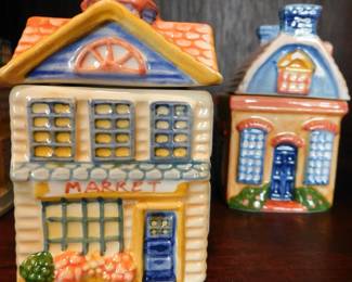 vintage Avon Spice Cottage Jars, collectible ceramic containers shaped like different houses.