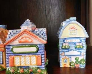 vintage Avon Spice Cottage Jars, collectible ceramic containers shaped like different houses.