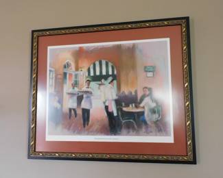 Framed print featuring impressionistic waiters serving coffee and beignets, reminiscent of the atmosphere at Café du Monde in New Orleans
