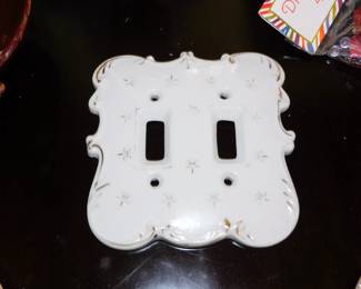 White porcelain double light switch cover plate with gilded floral and scrollwork details