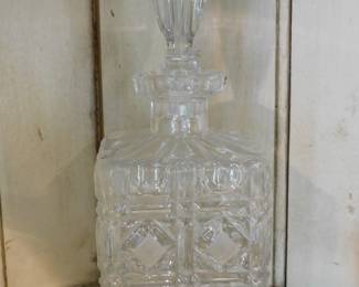 Vintage crystal whiskey decanter featuring a square body with a detailed diamond-cut pattern