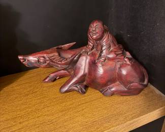 Wood water buffalo with man