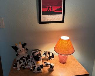 Sith poster, cow collection and small pink lamp