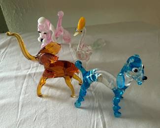 Small glass elephant, poodle, dog and bird