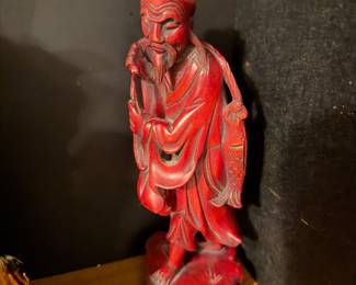 Red lacquer Asian monk