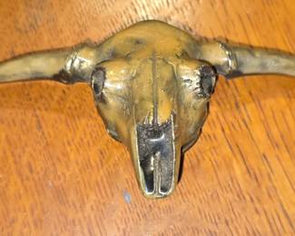 Brass and enamel belt buckle.
