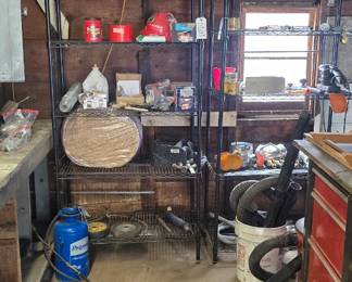 Craftsman work bench with drawers.  Shop vac, shelving and more.