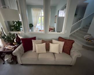 Matching Cream Tufted Sofas – $275 each or $500 for the pair. Elegant rolled-arm design with nailhead trim and coordinating accent pillows. Great condition
