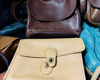 A collection of vintage coach leather bags.