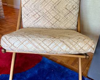 A pair of FOLKE OHLSSON DUX SCISSOR CHAIRS.