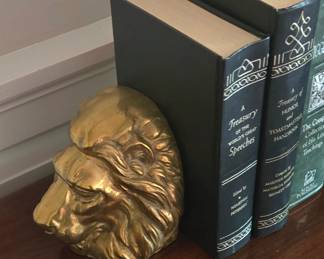 Vintage solid brass lion head bookends.