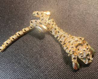 A Stunning Gold Leopard Brooch with Rhinestone and Black Enamel