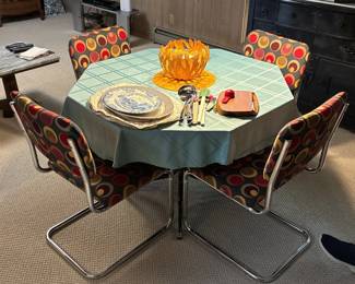 Vintage octogonal table with geometric patterned chairs