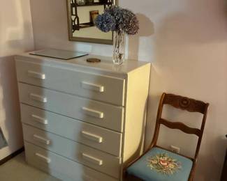 White dresser, embroidered chair