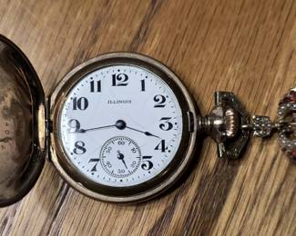 Illinois pocket watch with ornate pin