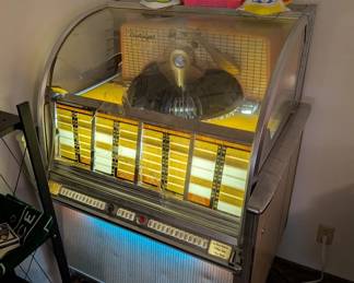 The Wurlitzer Juke Box is being sold for parts. The curved glass panel is broken, 2nd photo is a close up of the break.  It also make a loud hum when turned on that does not stop.