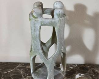 Carved Stone Sculpture With Connected Figures