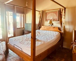 Queen Canopy Bed with adjustable base and mattress.