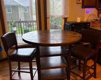 Great High Top Table with 3 shelves and 2 high top chairs