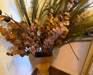 Pottery with dried eucalyptus and greenery