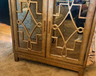 Gold Burnish cabit with mirrored and fretwork glass doors