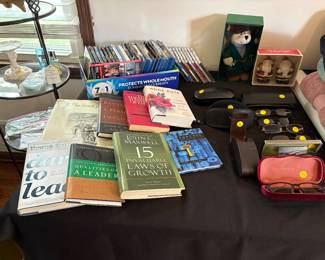 Books of all kinds, CDS, DVDs, Brand Sun and reading Glasses in cases. Coach case without glasses