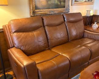 Leather recliner sofa. Both ends have wall hugger back. Seating on right side (when you are sitting)- foot recliner does not work. Needs to be readjusted or reconnected. Left side works great. Beautiful condition and great stitching.