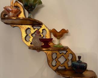 This unique shelf with gold leaf finish