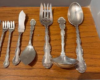 S2 - $1,600. BUY IT TODAY PRICE. Or Highest Offer by Friday 9AM. Sterling. 744 grams. Mostly Monogrammed Sterling Flatware - see photo of piece count. STERLING WILL NOT BE AT THE HOME. IT WILL BE SOLD PRIOR TO SALE OPENING.