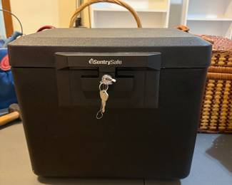 R62 - $20. Sentry Safe with Key.