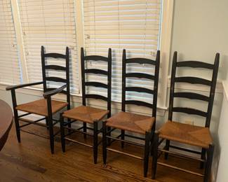 R39 - $150. Shaker style ladderback chairs. Distressed black. 3 side chairs 1 arm chair. All are very sturdy - backs show rubbing wear from sitting/table. Measures 17" wide x 13.75" deep x 42" tall. Floor to seat is 17.5".