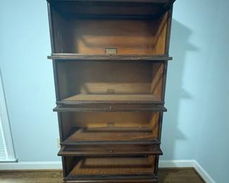 R29 - $500. Globe-Wernicke 4 Stack Barrister Bookcase. Bottom panel has a crack in the glass. Measures 34" wide x 11" deep x 67" tall.