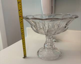 R51 - $12. Vintage Heavy Clear Pressed Glass Pedestal Fruit Bowl Measures 8" tall x 10" wide.