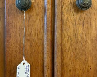 R25 - $60. Entertainment Armoire in Excellent Condition. Has outlets inside. Measures 46" x 26" x 67" tall.