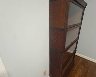 R29 - $500. Globe-Wernicke 4 Stack Barrister Bookcase. Bottom panel has a crack in the glass. Measures 34" wide x 11" deep x 67" tall.